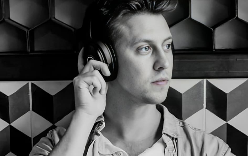 A Person Wearing XX99 Mark II Black Headphones